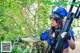 A woman in a police uniform holding a rifle.